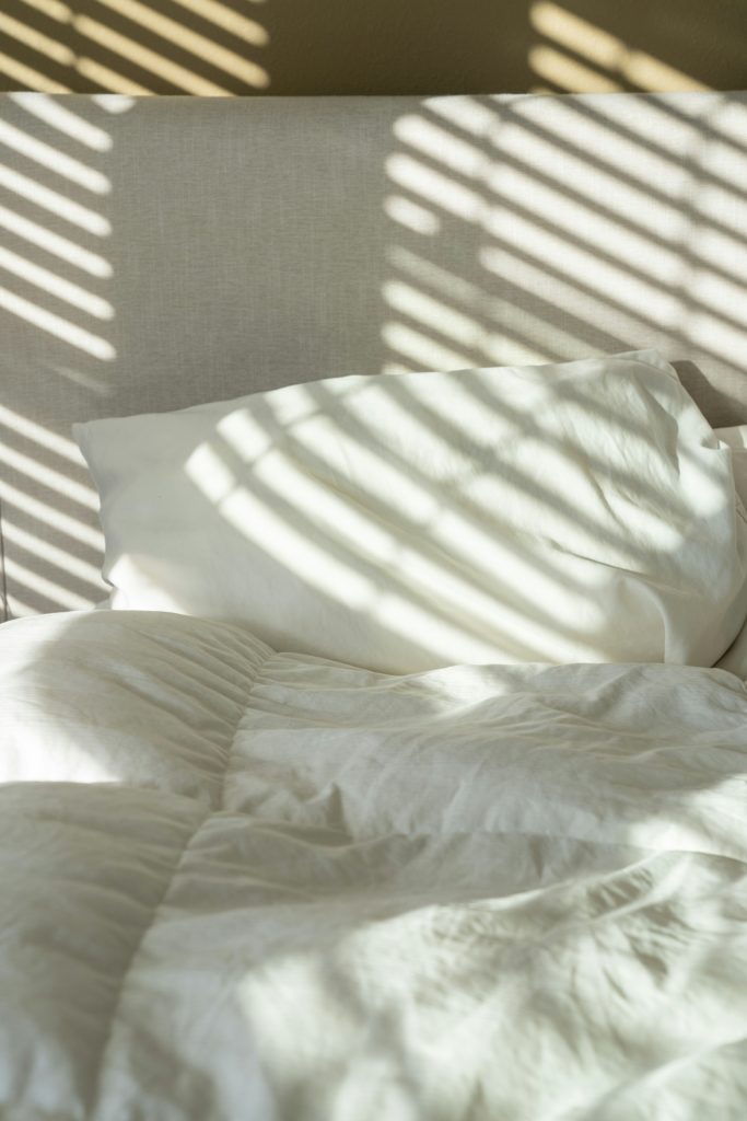 5 Expert Tips On How To Sleep During A Heatwave (And No, Sleeping Naked Isn't One Of Them)